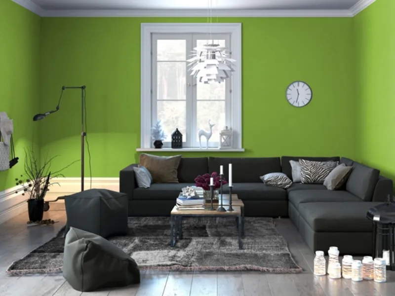 Zona living dal design minimale in verde e grigio
