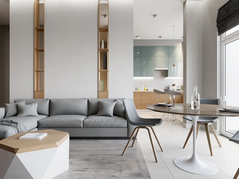 Pochi colori e materiali (bianco, grigio, legno) mixati tra loro rendono il living leggero ed equilibrato, decisamente più grande.