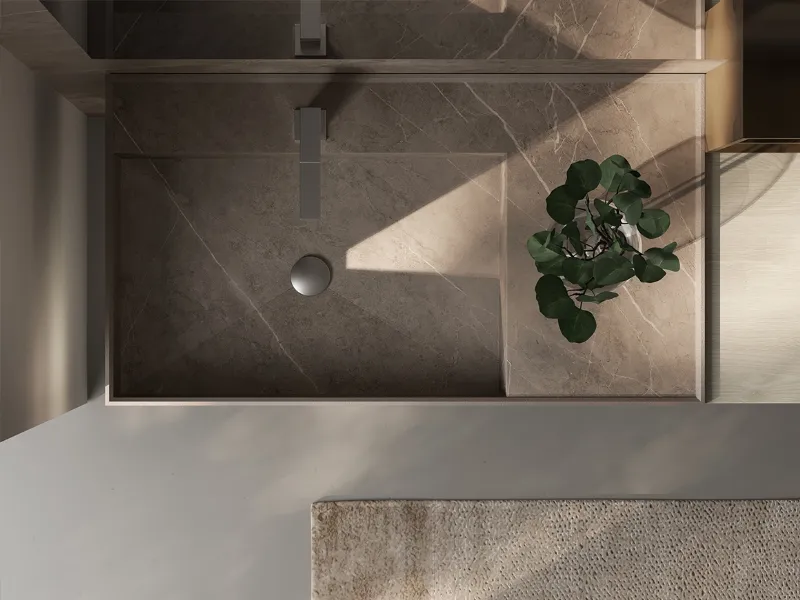 Tutta l’eleganza del gres effetto venato con il lavabo integrato