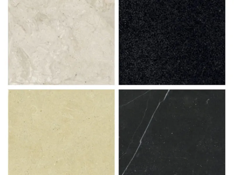 quattro piastrelle in marmo bianco, nero, ocra, antracite