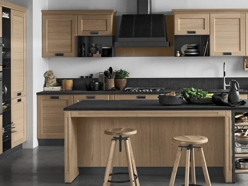 Da un lato contenitore, dall’altro tavolo snack con due sgabelli: l’isola York di Stosa Cucine