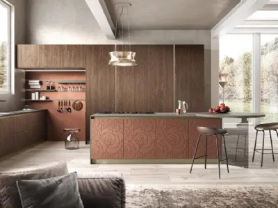 Isola con piano di cottura a induzione e capace tavolo accostato per la cucina College by Moretti Compact Cucine