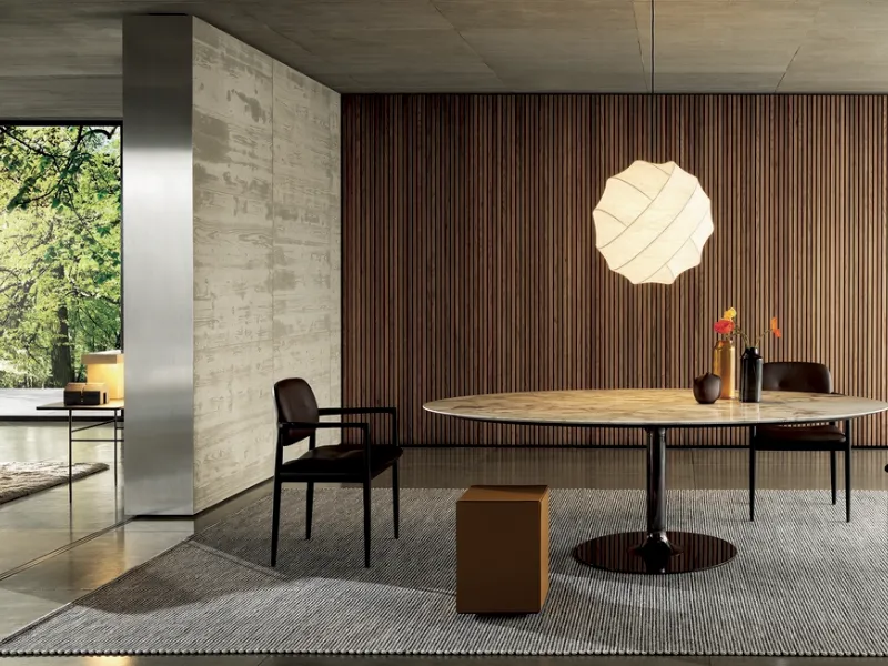 Tavolo Oliver Dining di Minotti Italia con top in marmo e base metallica