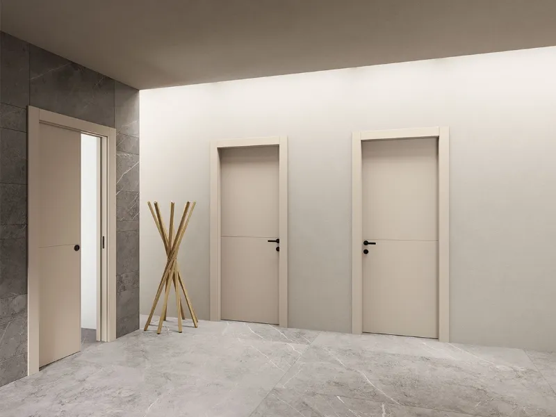 Le porte in legno laccato opaco Cashmere della serie Orbita di Pivato presentano maniglie nere opache