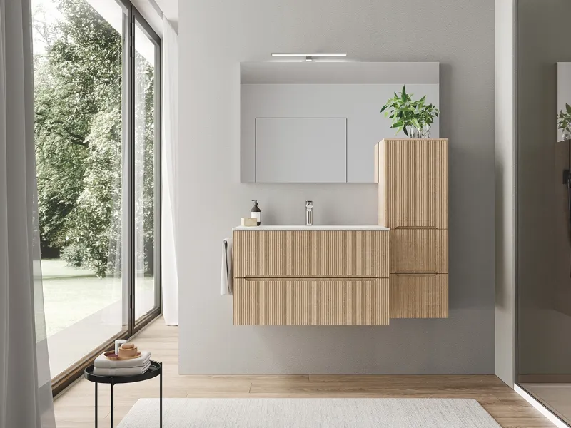 Forme essenziali e tanto spazio contenitivo per i mobili bagno Smyle